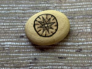 Wanderer’s Compass – Hand-Burned Pyrography Pebble